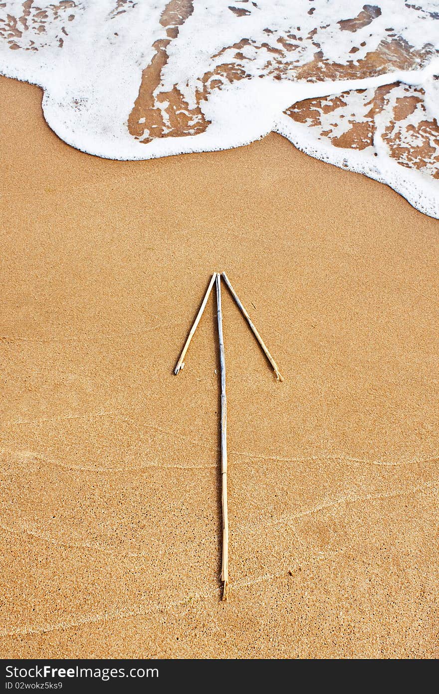 Arrow on the beach in suny summer day