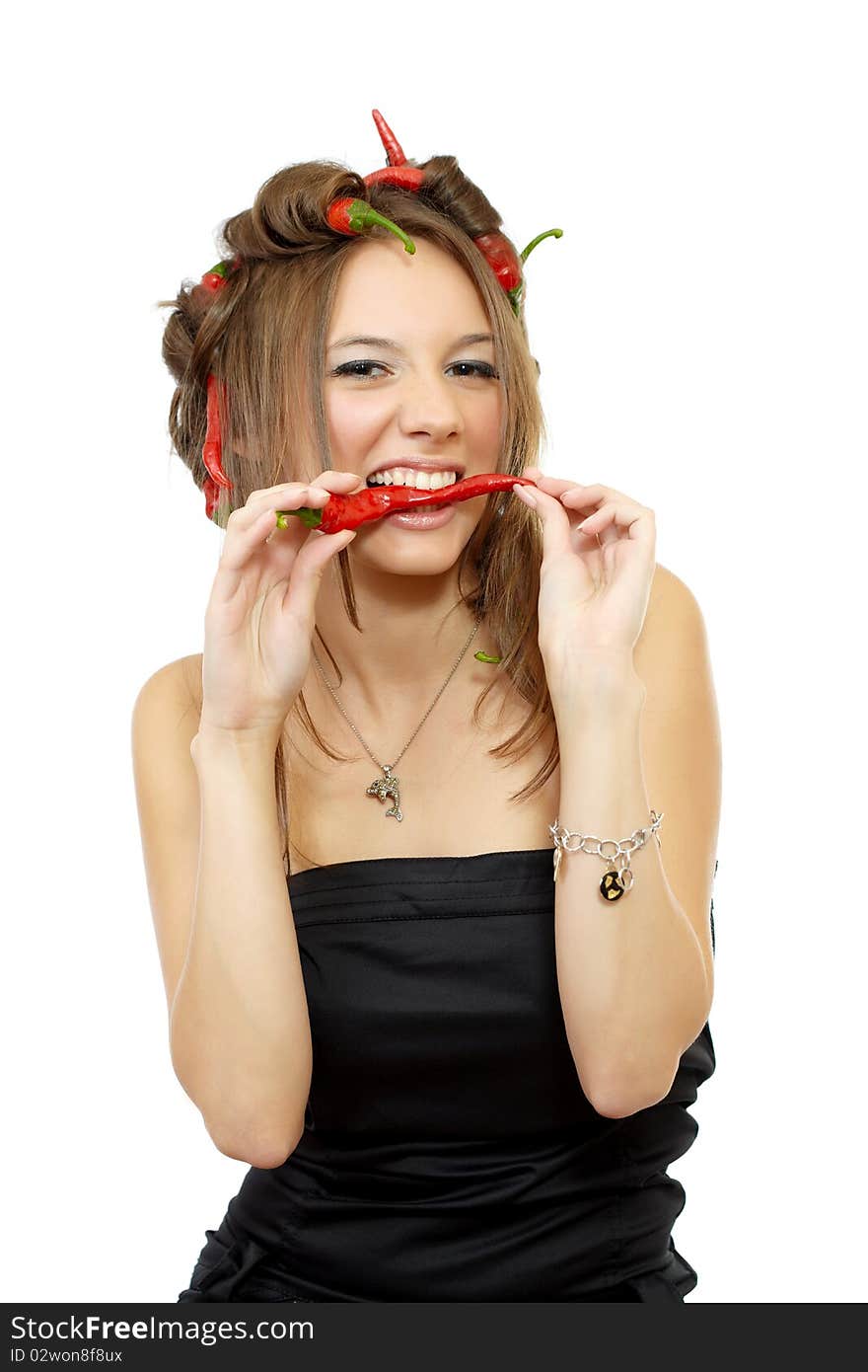 Portrait of a young woman with creative hair style with red hot chili peppers in her hair isolated on white. Portrait of a young woman with creative hair style with red hot chili peppers in her hair isolated on white