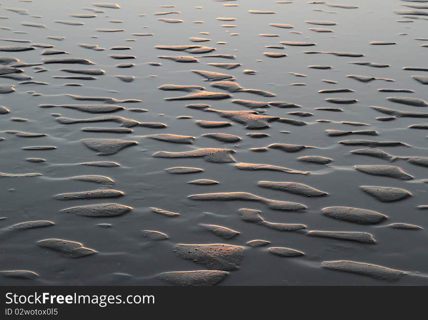 3D abstract effect created with sand and water in soft evening light. 3D abstract effect created with sand and water in soft evening light.