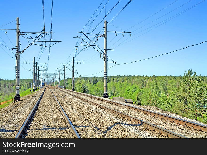 Two railway ways in summer for movement of trains on electrodraft. Two railway ways in summer for movement of trains on electrodraft