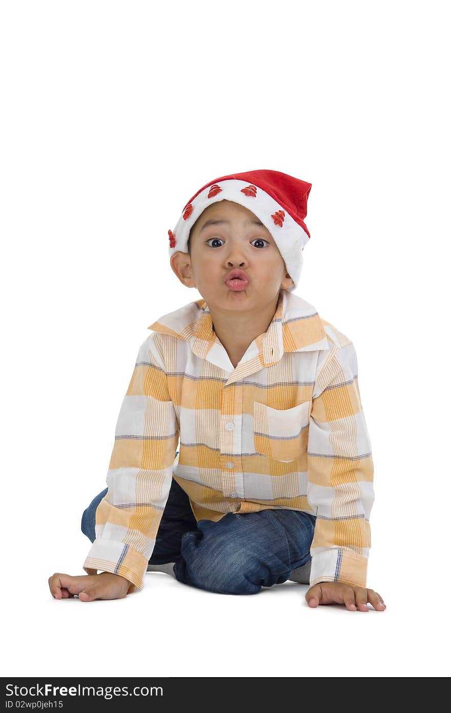 Cute boy with santa claus hat, isolated on white background