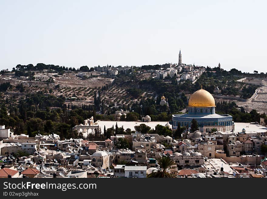 The Old City of Jerusalem, punctuated by the Dome of the Rock, with the Mount of Olives in the background. The Old City of Jerusalem, punctuated by the Dome of the Rock, with the Mount of Olives in the background.