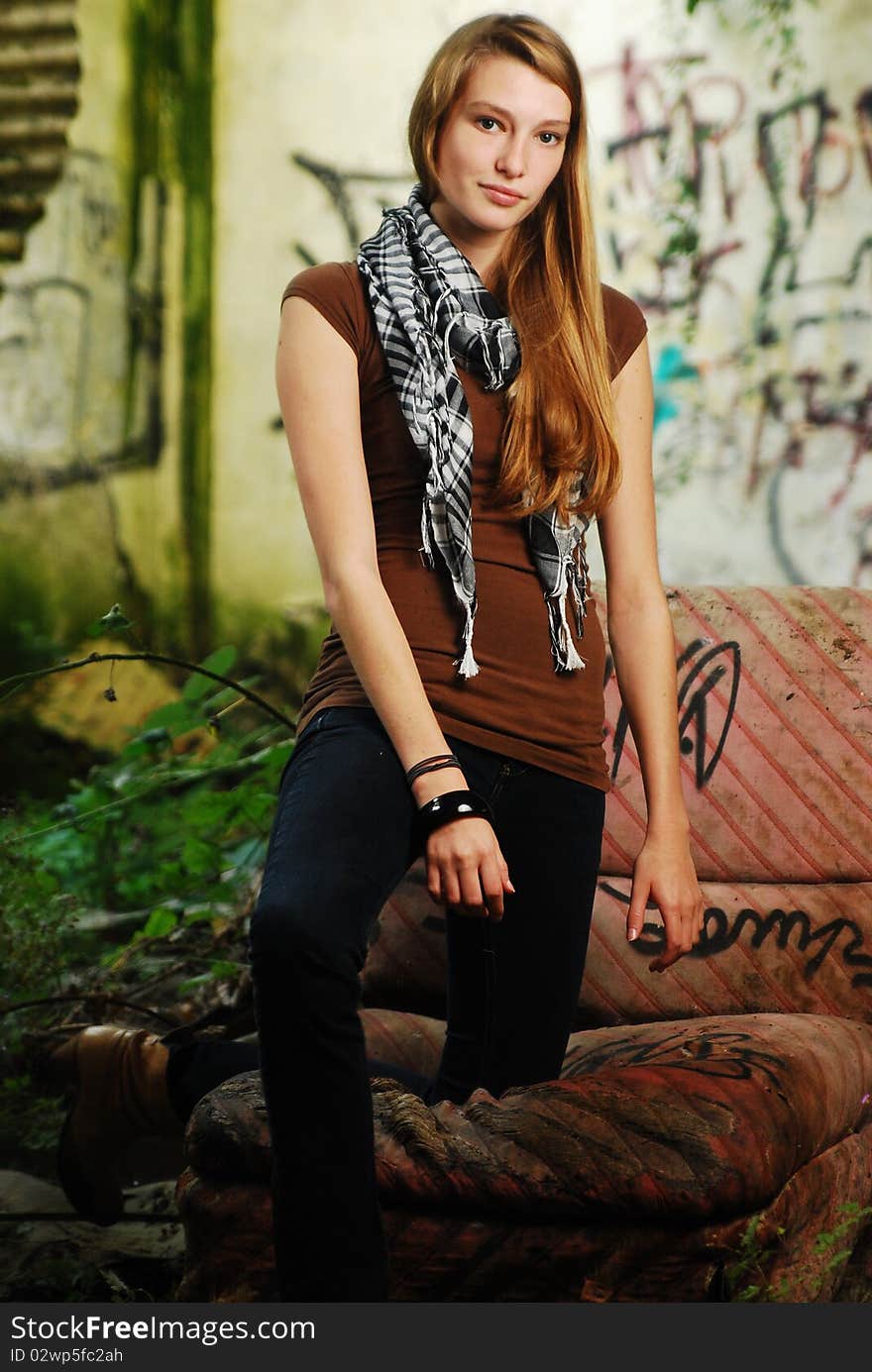 Model standing in front of a graffiti wall. Model standing in front of a graffiti wall