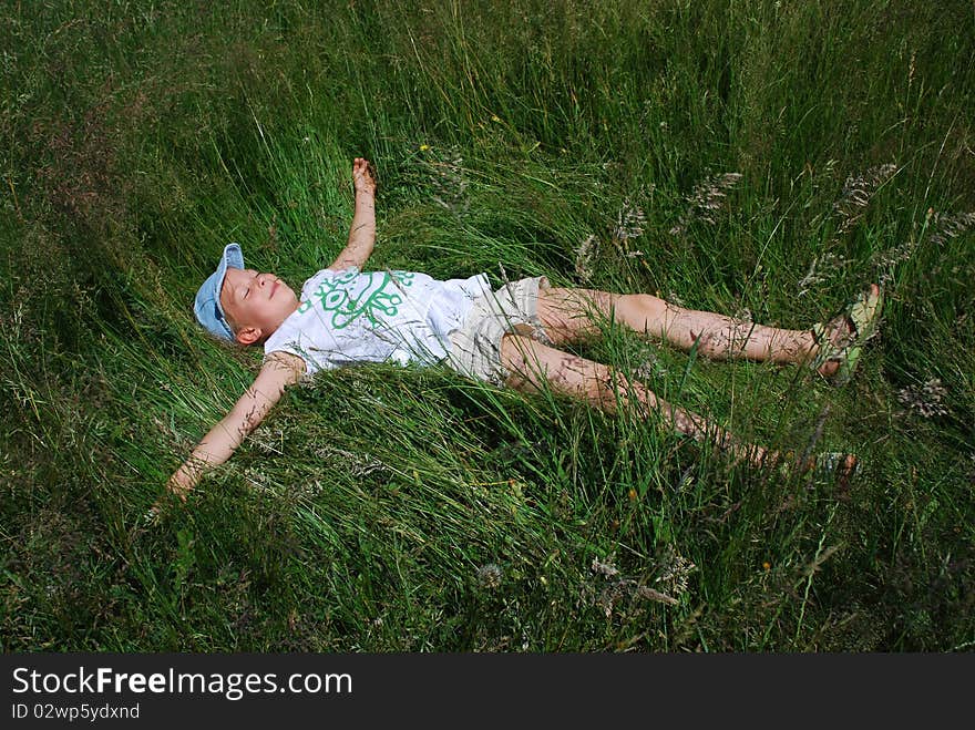 Girl Resting In Meadow