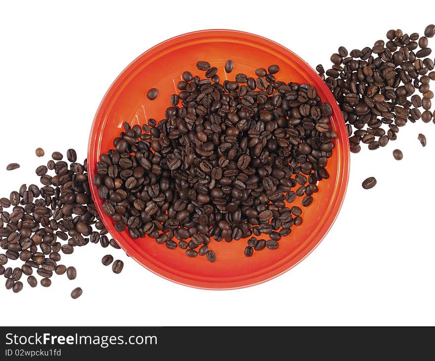 Red dish full of  coffee beans on the white background. Red dish full of  coffee beans on the white background