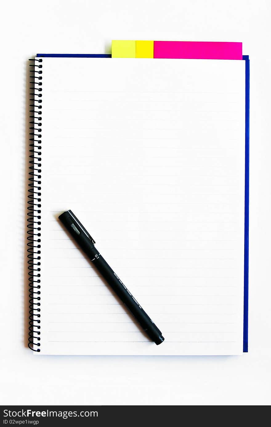 Blank notebook with a pen isolated on white background