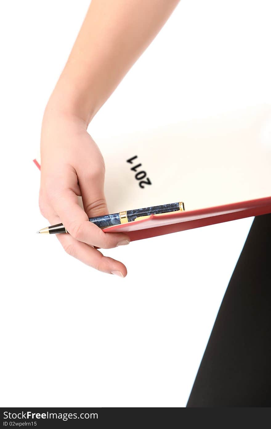 Woman holding a pen and a 2011 agenda. Woman holding a pen and a 2011 agenda