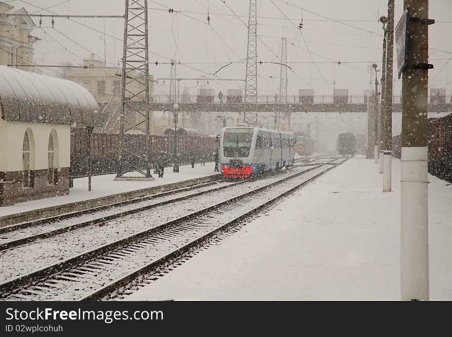 Railcar stands on a snowy winter station. Blizzard. Railcar stands on a snowy winter station. Blizzard