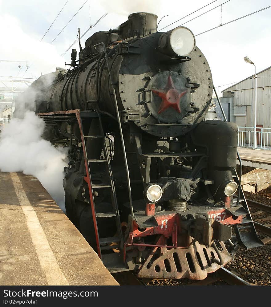 Russian steam locomotive on the railway. Russian steam locomotive on the railway