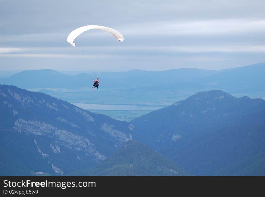 Tandem paragliding in High Tatras, Slovakia. Summer time in mountains. Tandem paragliding in High Tatras, Slovakia. Summer time in mountains.