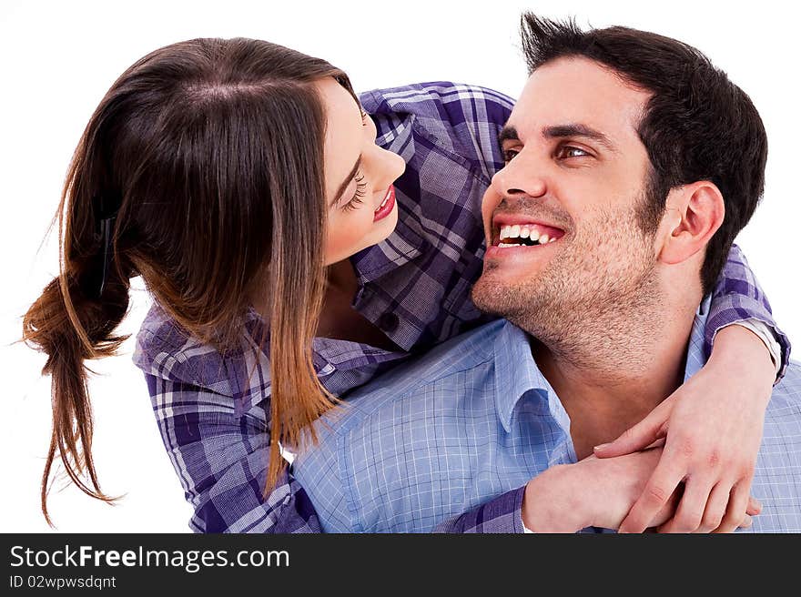 Closeup portrait of a cute young woman hugging her husband from behind. Closeup portrait of a cute young woman hugging her husband from behind