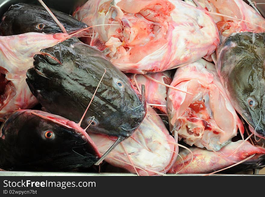 Cut of fish heads for sell in market.