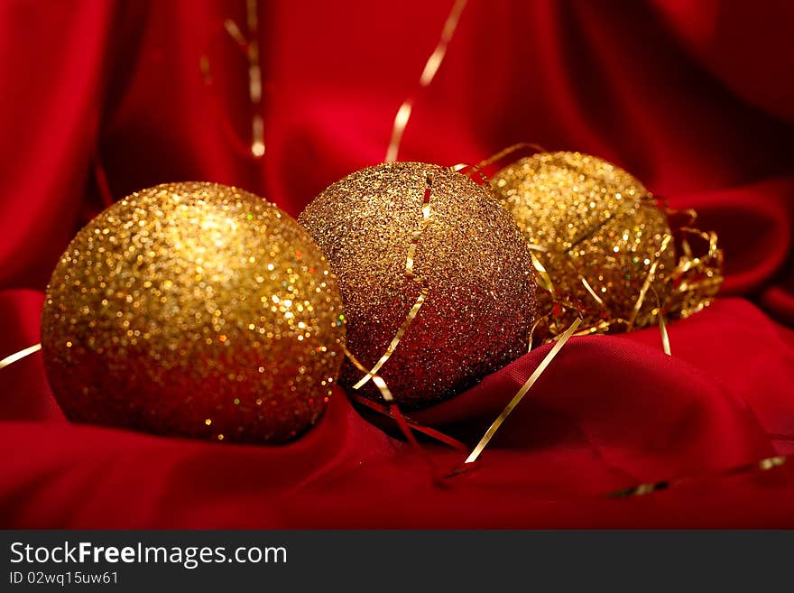 Christmas decoration. Gold Christmas balls on red background