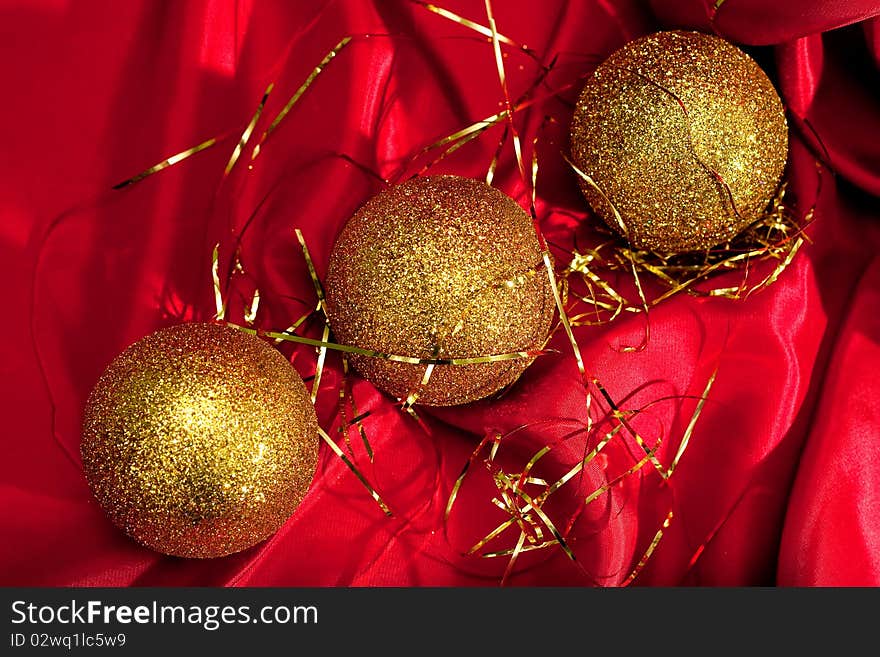 Christmas decoration. Gold Christmas balls on red background