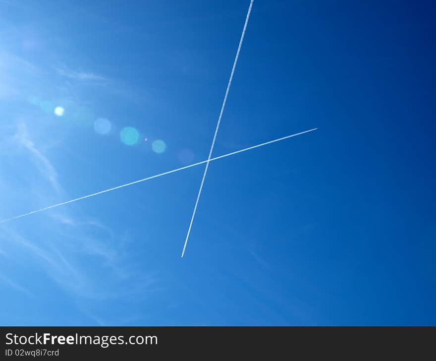 Trace of two airplanes in the pure blue sky