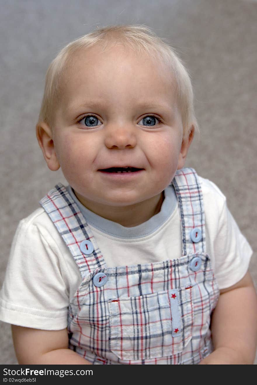 Cute blond toddler boy posing. Cute blond toddler boy posing