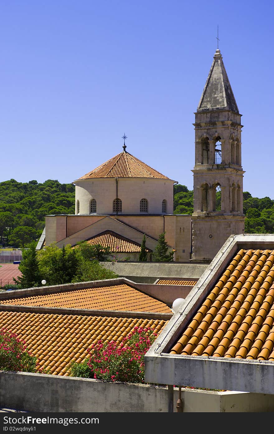 Ancient tower against the blue cloudless sky. Ancient tower against the blue cloudless sky