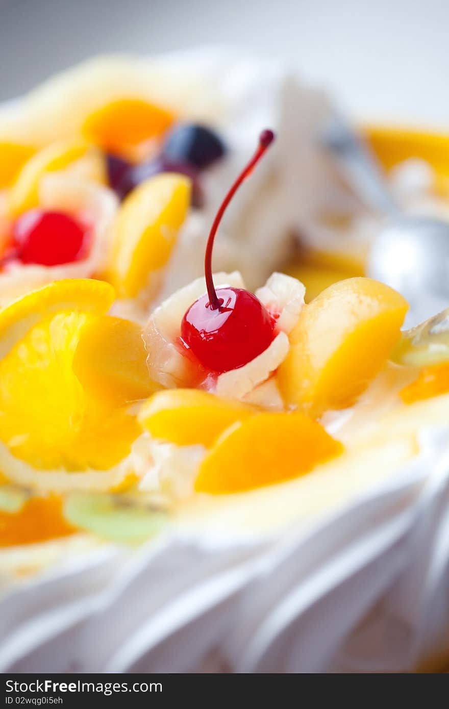 Pie Decorated With Fruit And A Cherry