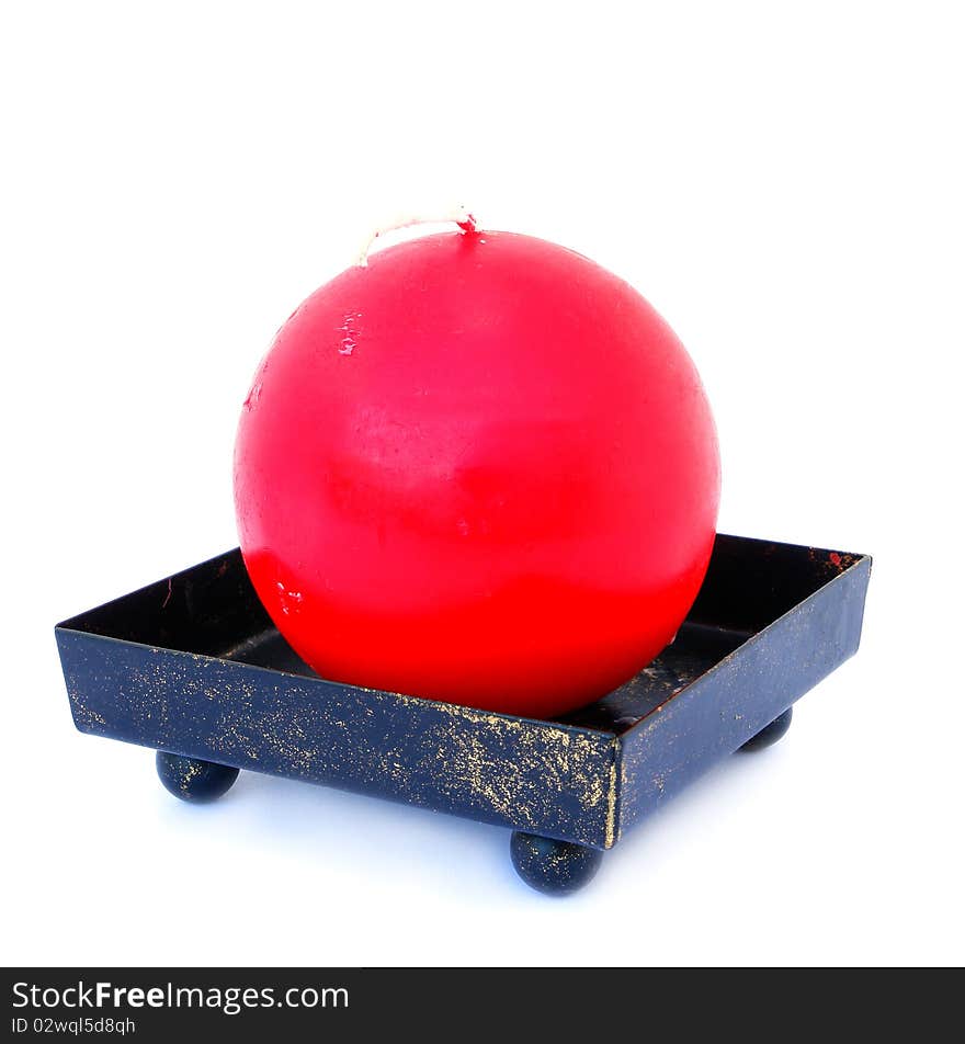 Round red candle isolated on the white background. Round red candle isolated on the white background