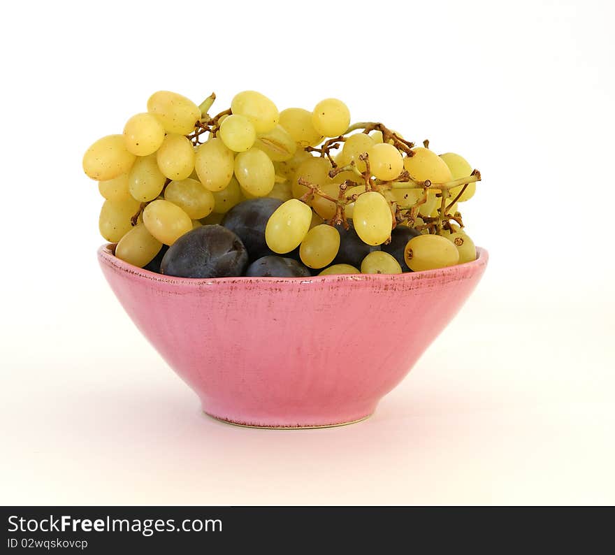 Grapes And Plums In A Pink Vase