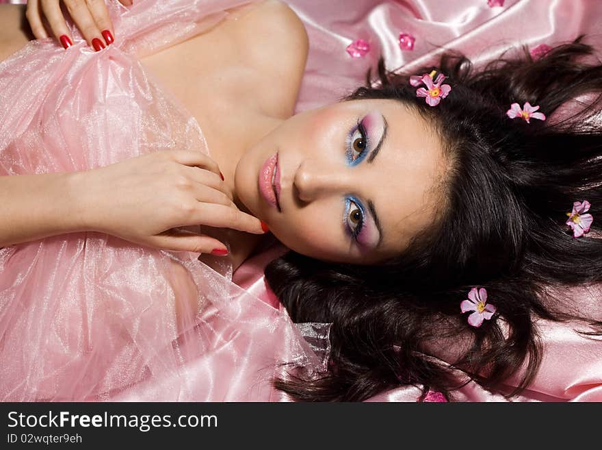 Tender girl with pink flowers