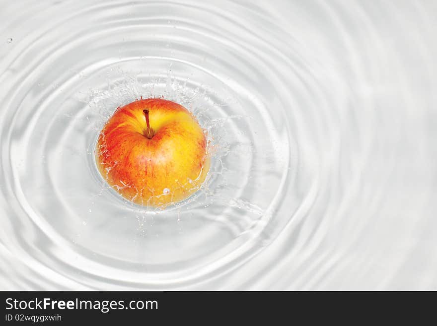 Symbol of freshness; fruits splash in water. Symbol of freshness; fruits splash in water