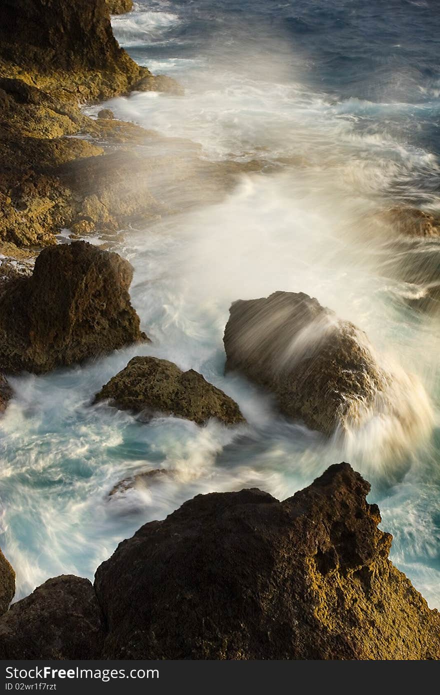 Wave crashing on Aruban coastline during sunrise. Wave crashing on Aruban coastline during sunrise