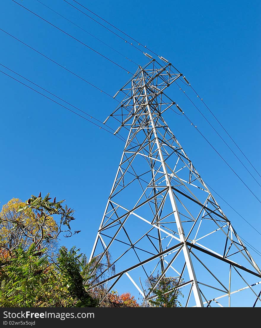 Electricity Pylon against bright blue sky. Electricity Pylon against bright blue sky