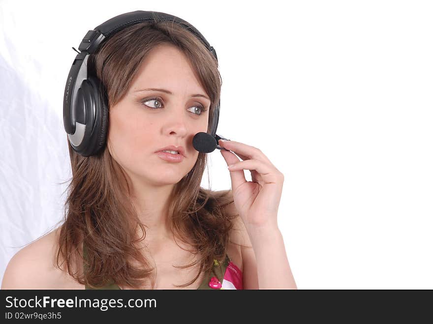 Successful female call centre employee speaking over the headset.