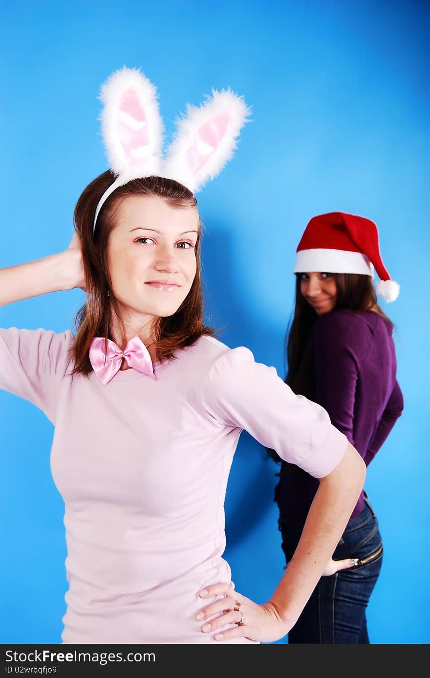 playgirl with bunny ears on a blue background. playgirl with bunny ears on a blue background.