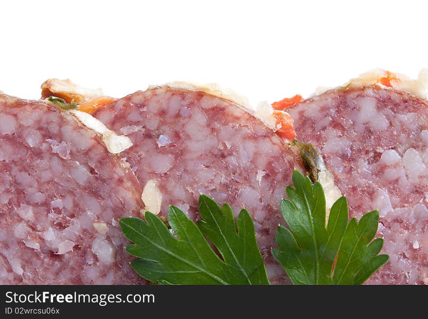 Close up of sliced salami with parsley, isolated on white. Close up of sliced salami with parsley, isolated on white