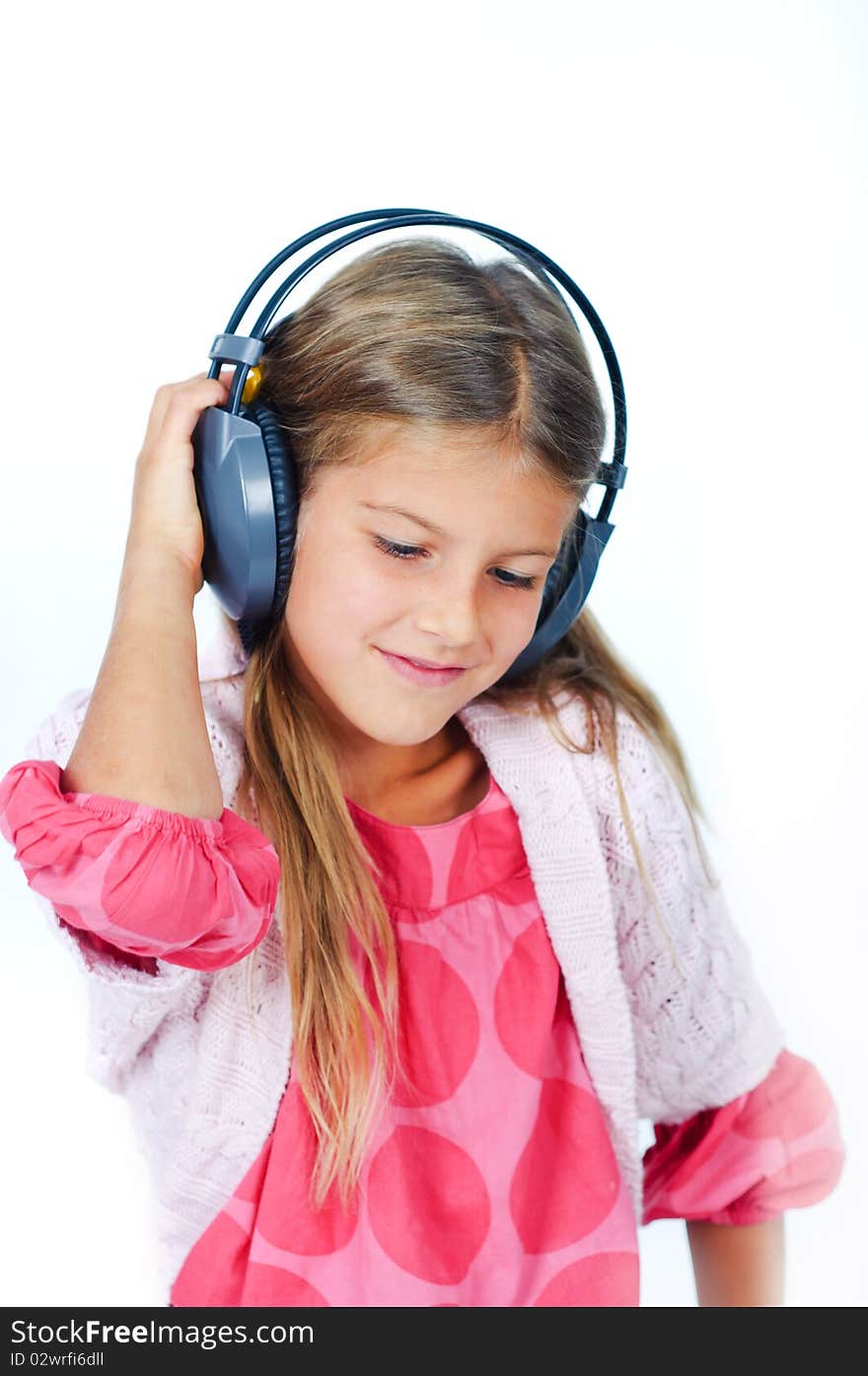 Portrait cute pretty girl with headphones. In the studio. Portrait cute pretty girl with headphones. In the studio