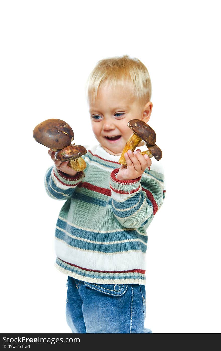 Little cute boy with mushrooms