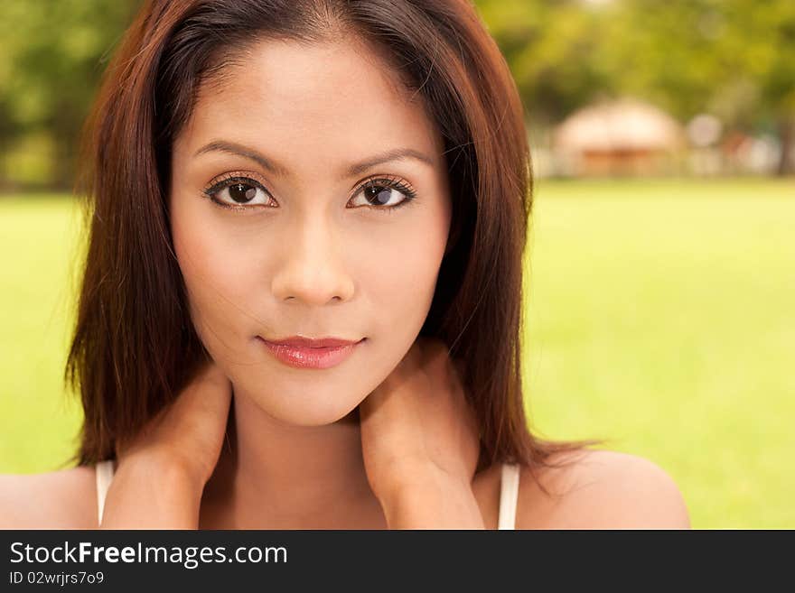 Close up portrait of young lady in park. Close up portrait of young lady in park