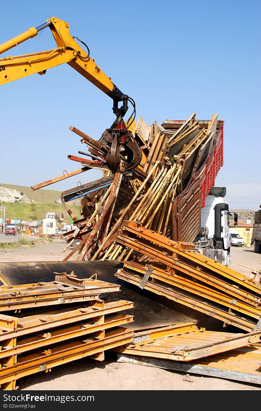 Industrial grabber in scrap metal facility. Industrial grabber in scrap metal facility