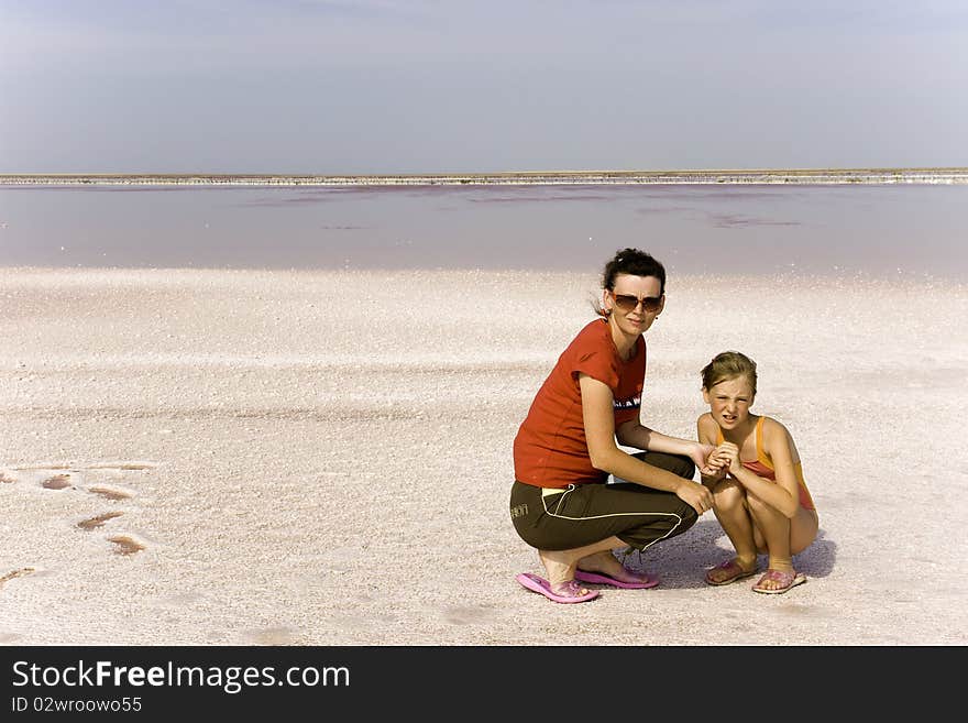 Mum and daughter on salty lake