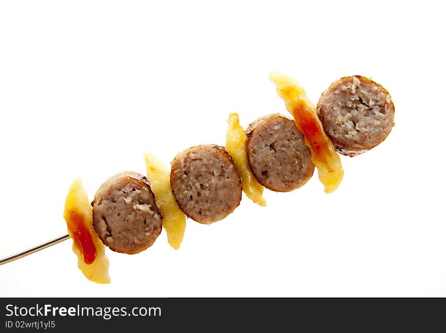 Coarse fried sausage with Fries on spit