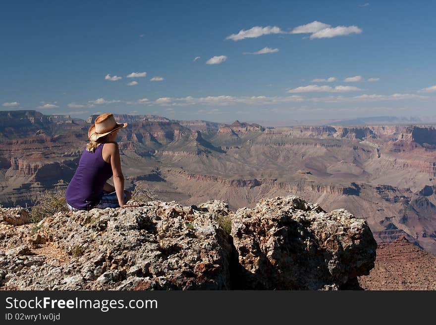 A woman enjoying the view of the canyons in USA