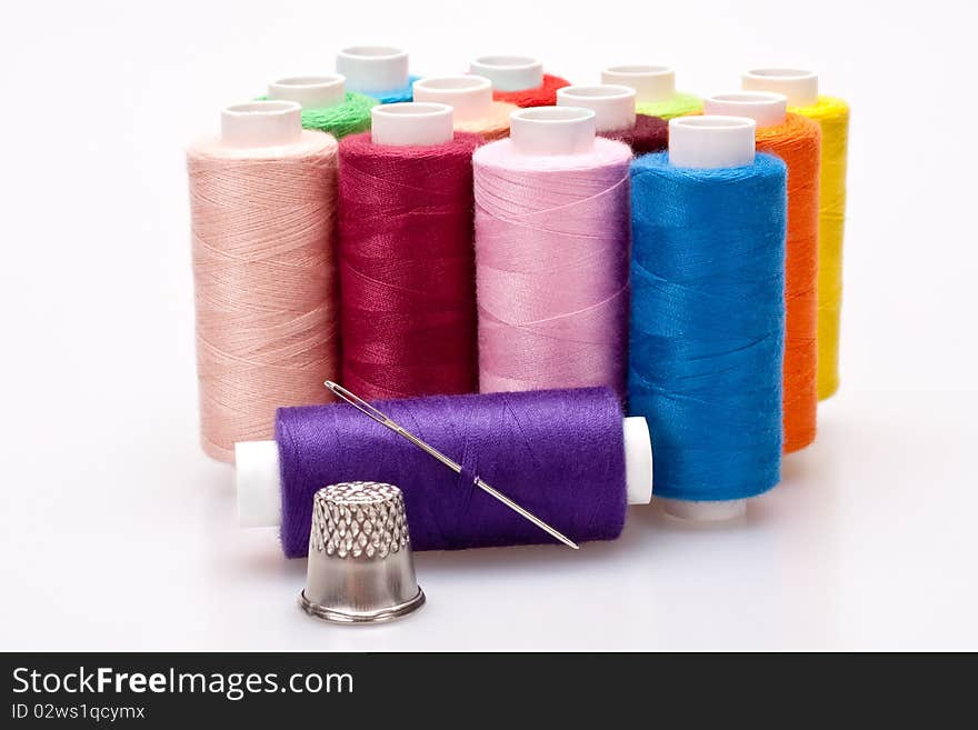 Colored thread for sewing with needle and thimble