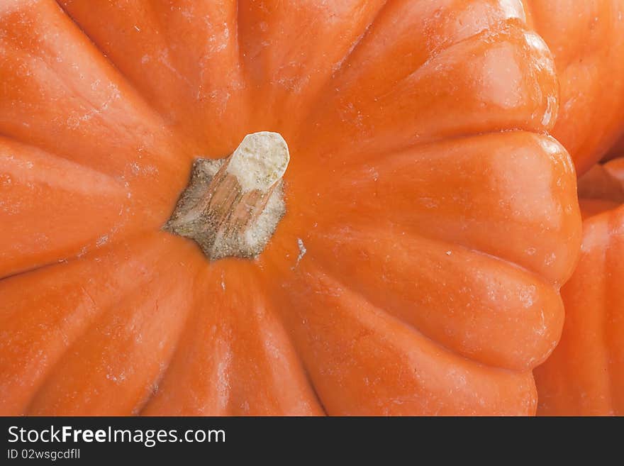 Small orange pumpkins symbolising autumn holidays and used in decorative works.