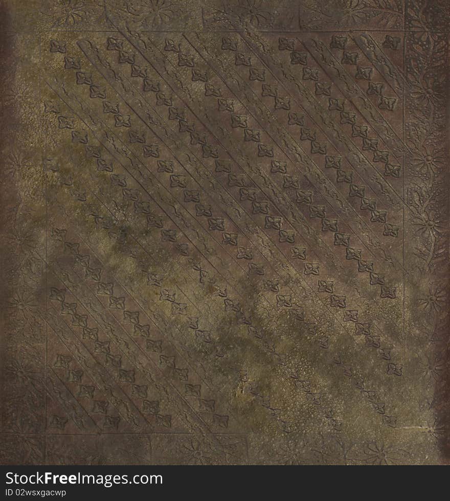 Decorative imprinted grungy brown parchment textured background. Decorative imprinted grungy brown parchment textured background