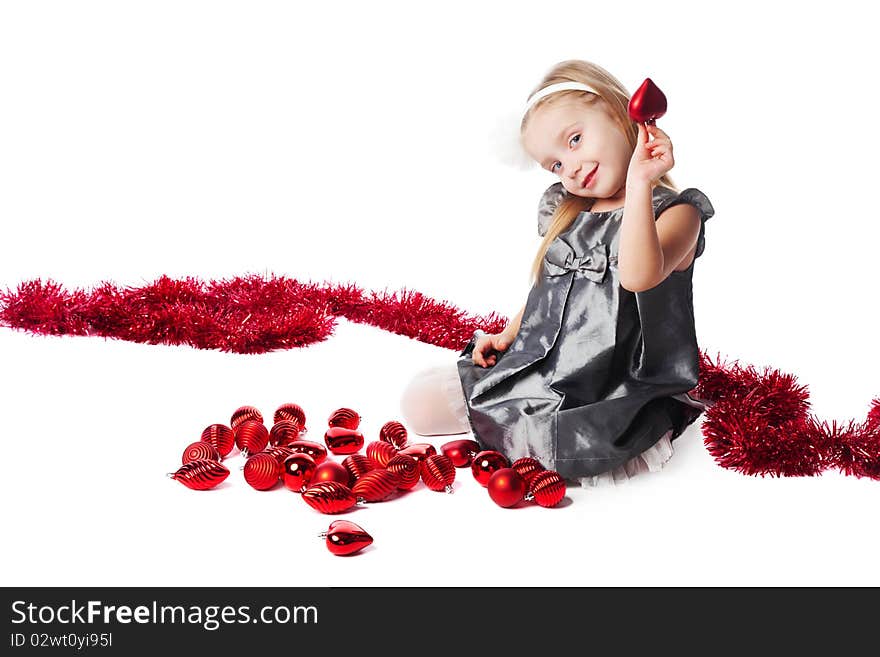 Smiling  little girl with new year toys