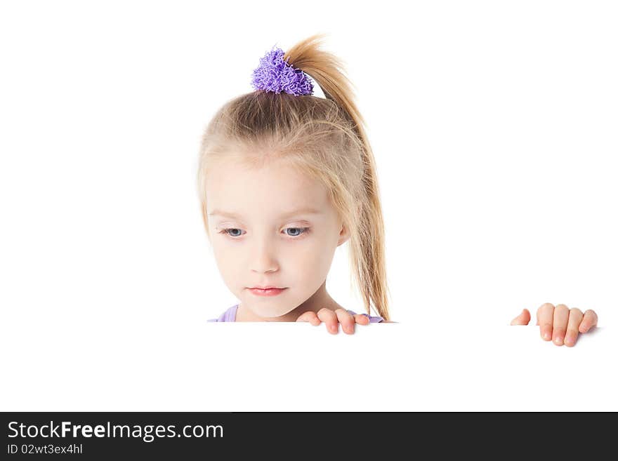 Little girl looking over empty board