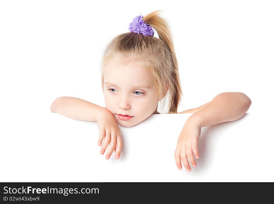 Little girl looking over empty board isolated