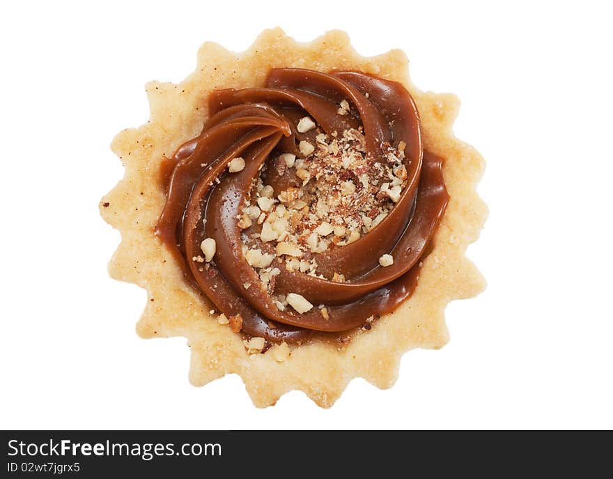 A pastry with nuts isolated over white. Top view.