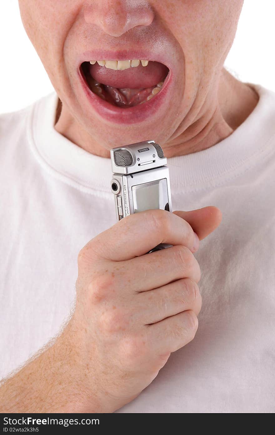 Man open mouth and scream in dictaphone. Close-up