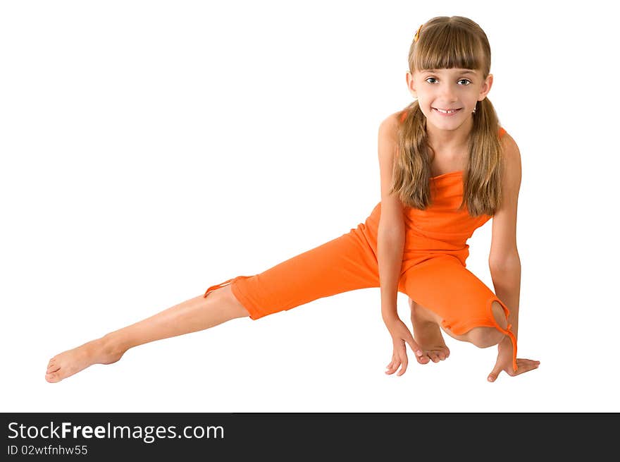 The girl in orange clothes is photographed on the white background