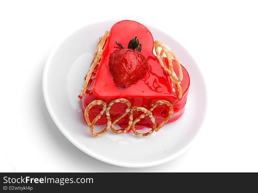 Cake with strawberry topping over white