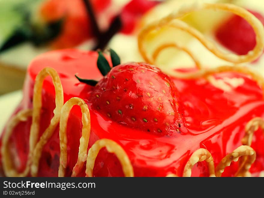 Cake with strawberry topping over white