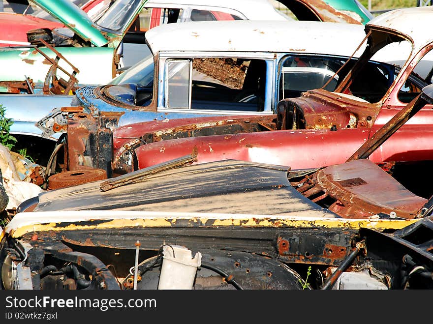 Vintage cars abandoned and rusting away in rural wyoming. Vintage cars abandoned and rusting away in rural wyoming